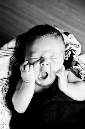 baby yawning doula iowa city doula cedar rapids postpartum doula infant sleep support childbirth education breastfeeding classes